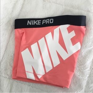 Nike pink/salmon color spandex shorts